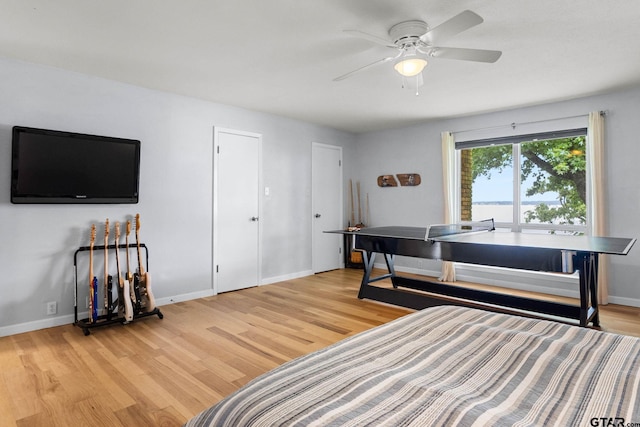 21028 Bay Shore Dr, Flint, TX 75762 - bedroom featuring light wood finished floors and ceiling fan