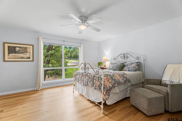 21028 Bay Shore Dr, Flint, TX 75762 - bedroom with wood finished floors and ceiling fan