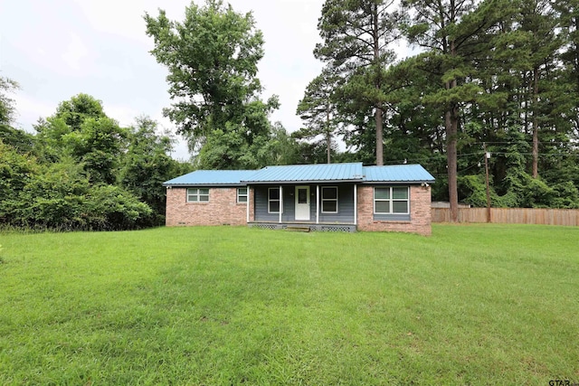 199 Linda Dr, Jefferson, TX 75657 - ranch-style home with brick siding, covered porch, and metal roof