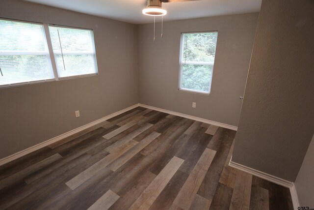 199 Linda Dr, Jefferson, TX 75657 - spare room with dark wood finished floors and baseboards