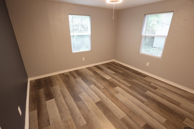 199 Linda Dr, Jefferson, TX 75657 - empty room with dark wood-type flooring and baseboards