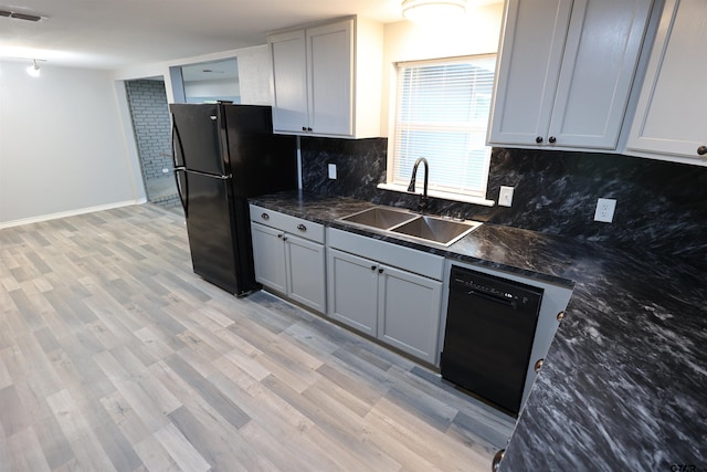 199 Linda Dr, Jefferson, TX 75657 - kitchen with black appliances, a sink, backsplash, gray cabinets, and light wood-type flooring