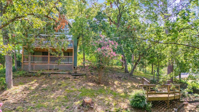 view of yard with a deck