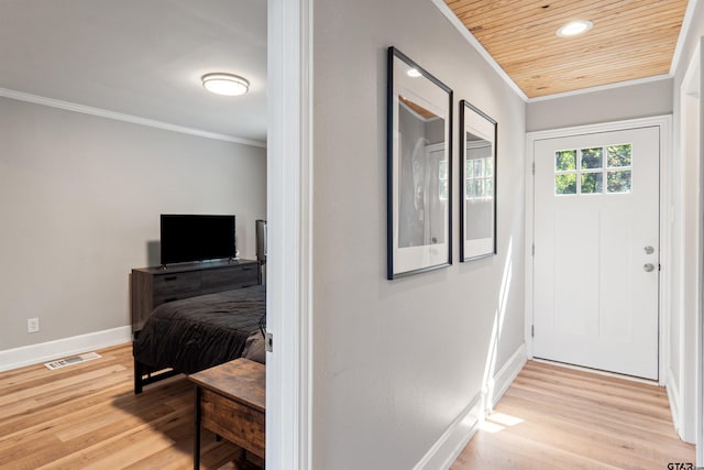 entryway with light hardwood / wood-style floors, crown molding, and wood ceiling