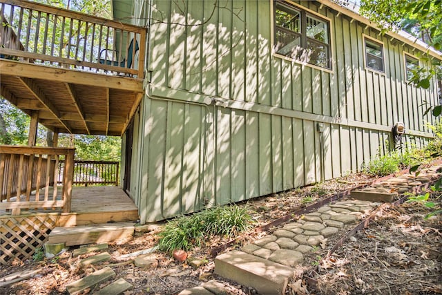 view of side of property with a wooden deck