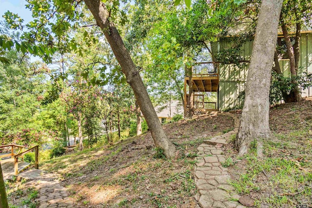 view of yard featuring a wooden deck