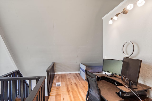 office area with light hardwood / wood-style floors