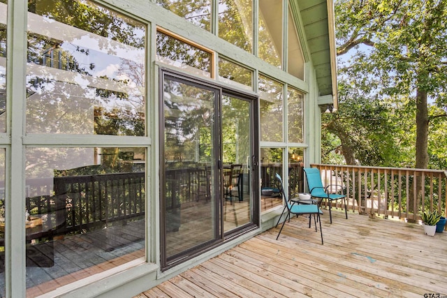 unfurnished sunroom with vaulted ceiling