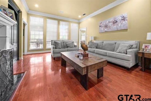 living room featuring ornamental molding and wood-type flooring