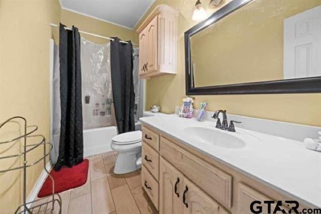 full bathroom with shower / bathtub combination with curtain, vanity, and toilet