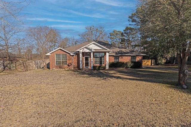 ranch-style home with a front yard