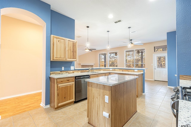 kitchen featuring a center island, light stone countertops, dishwasher, sink, and light tile patterned flooring