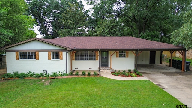 single story home with a front lawn and a carport