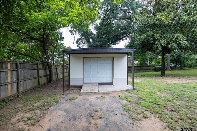 garage with a lawn