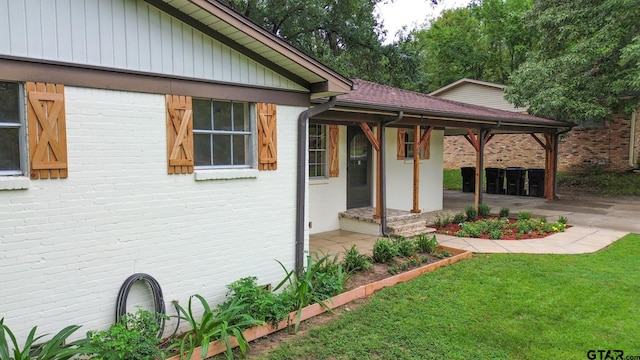 view of side of home featuring a lawn