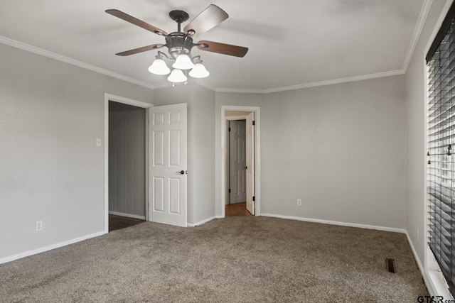 unfurnished bedroom featuring carpet, ceiling fan, and ornamental molding