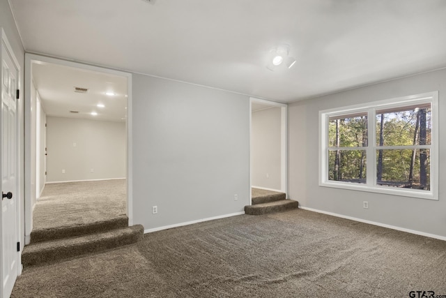 empty room featuring carpet flooring