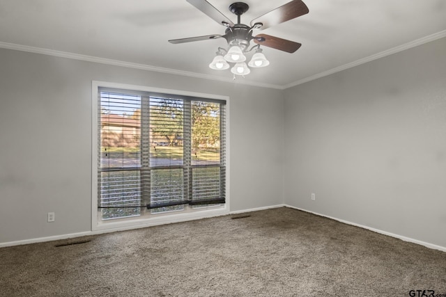 empty room featuring carpet, ceiling fan, and crown molding