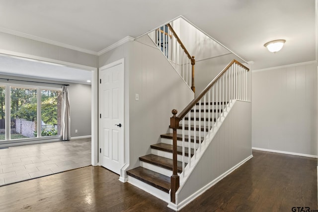 stairs featuring hardwood / wood-style floors and crown molding