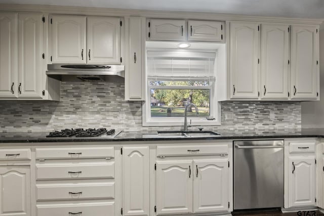 kitchen featuring white cabinets, backsplash, sink, and stainless steel appliances