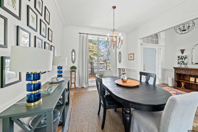 dining space with a notable chandelier, hardwood / wood-style flooring, and crown molding