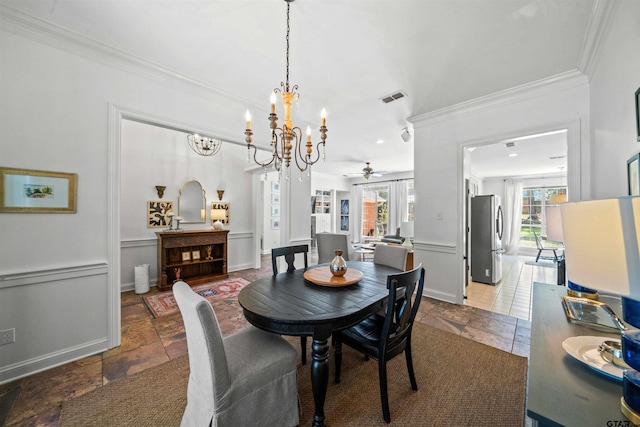 dining area featuring ceiling fan and crown molding