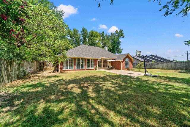 11213 Chasewood Dr, Tyler, TX 75703 - back of property featuring french doors, a patio area, brick siding, and a chimney