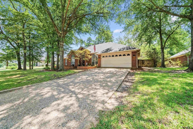 ranch-style house with a garage and a front yard