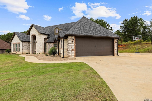 view of front facade featuring a garage and a front lawn