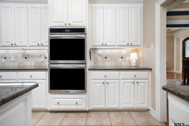 11208 Marsh Wren Cir, Flint, TX 75762 - kitchen with double oven, white cabinetry, dark stone countertops, and crown molding