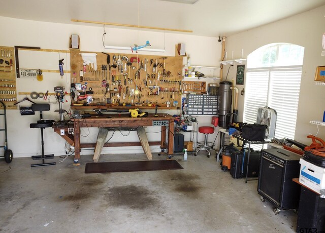 11208 Marsh Wren Cir, Flint, TX 75762 - garage with a workshop area and a central vacuum unit