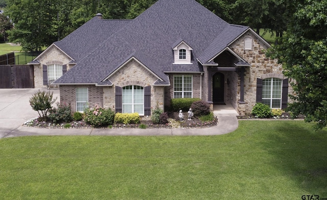 11208 Marsh Wren Cir, Flint, TX 75762 - french country style house featuring stone siding, roof with shingles, and brick siding