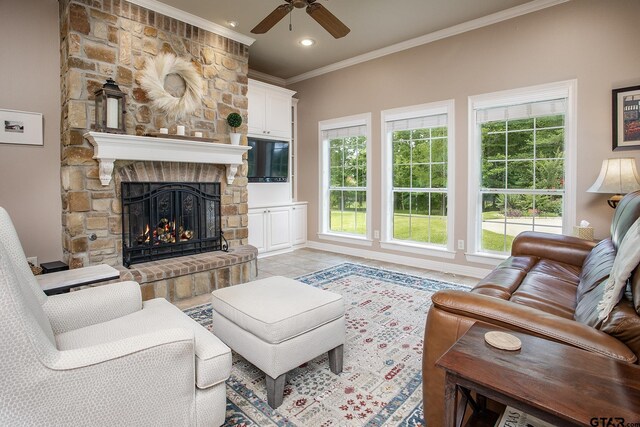 11208 Marsh Wren Cir, Flint, TX 75762 - living room featuring crown molding, ceiling fan, a fireplace, recessed lighting, and light tile patterned floors