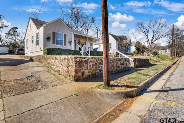 ranch-style home featuring fence