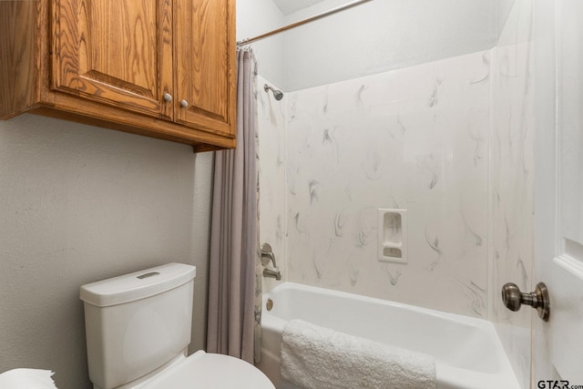 bathroom featuring toilet and shower / bathtub combination with curtain