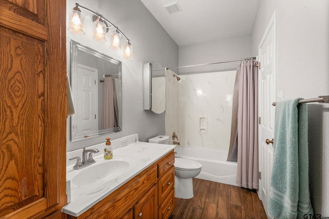 full bathroom with toilet, vanity, shower / bathtub combination with curtain, and hardwood / wood-style floors