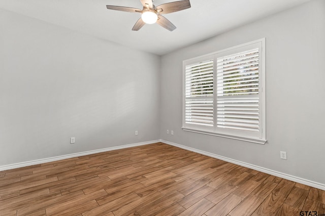 empty room featuring ceiling fan and light wood-type flooring