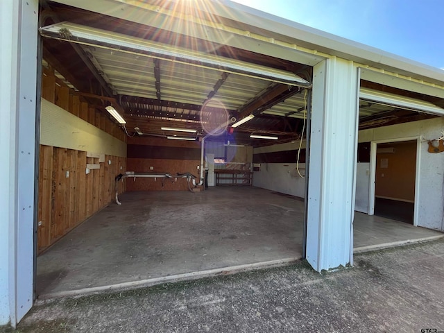 garage featuring wooden walls