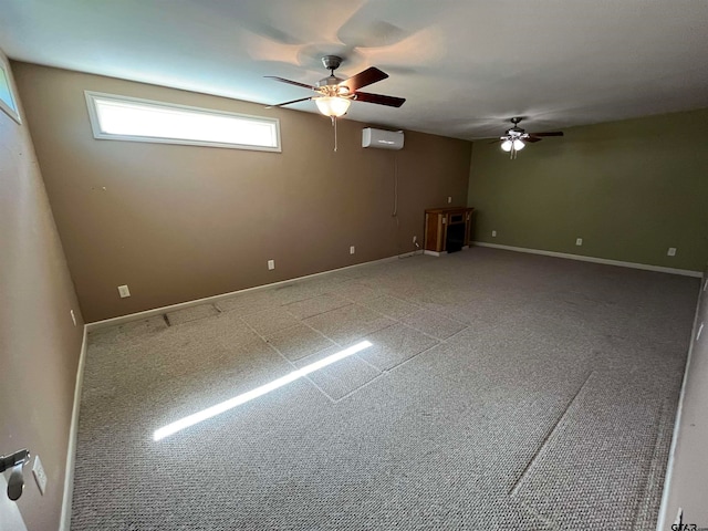 spare room with a wall mounted air conditioner and ceiling fan