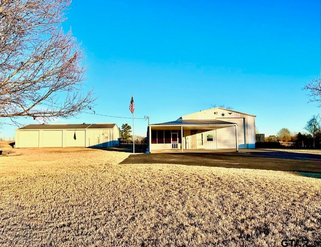 rear view of house featuring a lawn