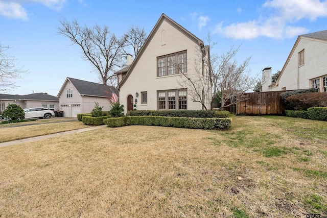 view of front facade featuring a garage and a front lawn