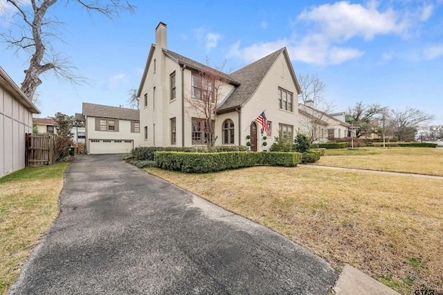 view of front of house featuring a garage and a front yard