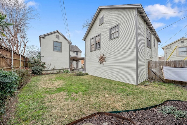 rear view of house with a lawn