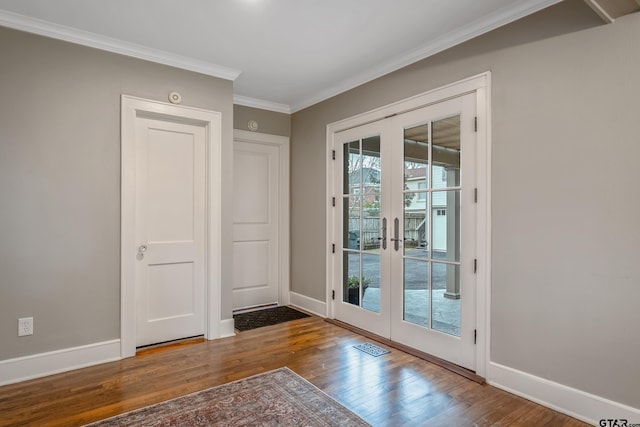 doorway to outside with ornamental molding, hardwood / wood-style floors, and french doors