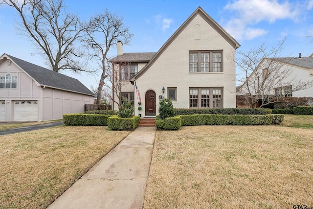 view of front of home with a garage and a front yard