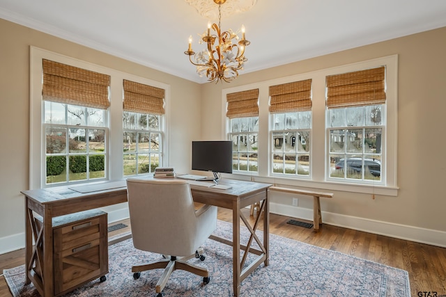 home office featuring crown molding, dark hardwood / wood-style floors, and a notable chandelier