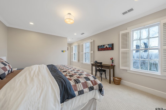 bedroom with multiple windows, ornamental molding, and carpet flooring