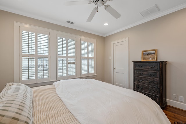 bedroom with multiple windows, crown molding, dark hardwood / wood-style floors, and ceiling fan