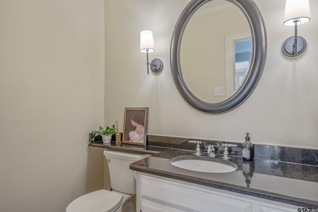 bathroom with vanity and toilet