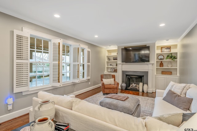 living room featuring crown molding and hardwood / wood-style floors